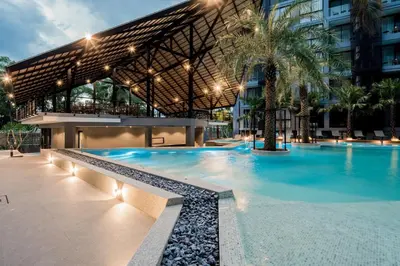a swimming pool in front of a building at Tropics Kamala Hill View Studio CTG P613 near Beach and Fantasea in Kamala Beach