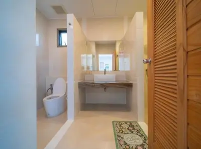a bathroom with a sink and a toilet at 2Exclusive 4BR Villa with Private Pool Kitchen Ideal for Families in Ban Bang La