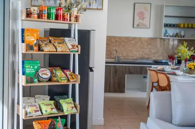 a shelf with food on it in a kitchen at 3Elegant 4BR Villa with Pool in Ban Bang La