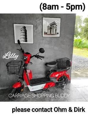 a red scooter parked next to a wall at Orchidilla Residence Phuket Mai Khao Beach - SHAPlus in Mai Khao Beach
