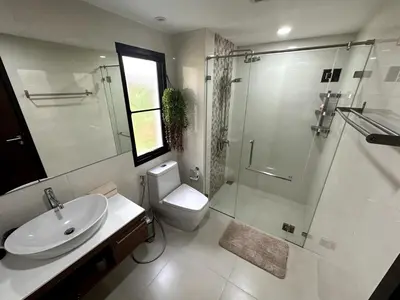 a bathroom with a toilet and a shower and a sink at Apartment Title III Rawai Phuket in Rawai Beach