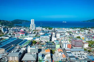 an aerial view of a city with the ocean at Phuket Patong Buri Resort in Patong Beach