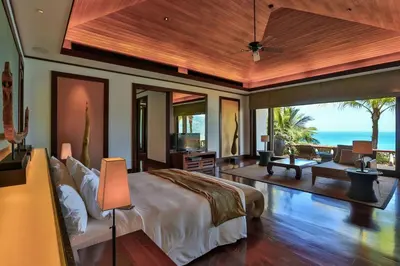 a bedroom with a bed with a view of the ocean at Villa Daran Luxury Villa with Panoramic Views & 5-Star Services in Kamala Beach