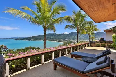 a balcony with a view of the ocean and palm trees at Villa Daran Luxury Villa with Panoramic Views & 5-Star Services in Kamala Beach