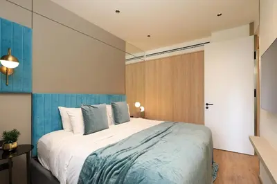 a bedroom with a large bed in a room at 1bdr New Apartment near Layan Beach in Ko Kala