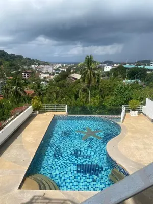 a swimming pool with a view of a city at Cristians lägenhet in Kata Beach