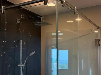 a shower in a bathroom with a glass door at Surin Mida Grande residence with jacuzzi and sea view - Bang Tao & Surin beach in Surin Beach