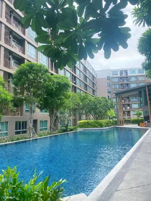 a swimming pool in the middle of a building at Dcreek 79 Modern chic condo near patong in Phuket Town