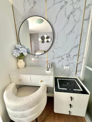 a dressing table with a mirror and a white chair at Dcreek 79 Modern chic condo near patong in Phuket Town