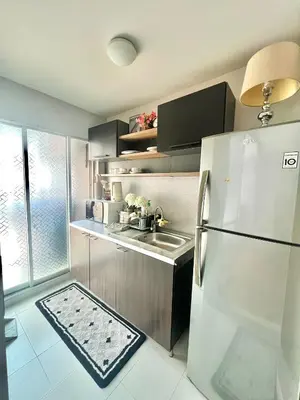 a kitchen with a refrigerator and a sink at Dcreek 79 Modern chic condo near patong in Phuket Town