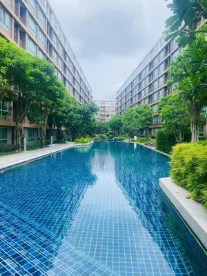 a swimming pool in the middle of a building at Dcreek 79 Modern chic condo near patong in Phuket Town