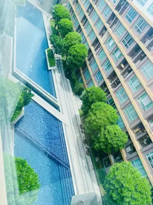an aerial view of a tall building with trees at Dcreek 79 Modern chic condo near patong in Phuket Town