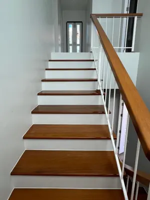 a staircase with white treads and wood railings at Supicha86 Sino ko kaeo Modern Private 3BR 3BA Villa in Ban Bang Khu