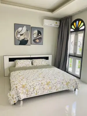 a bedroom with a bed and a window at Supicha86 Sino ko kaeo Modern Private 3BR 3BA Villa in Ban Bang Khu