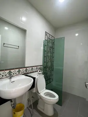 a bathroom with a toilet and a sink and a shower at Supicha86 Sino ko kaeo Modern Private 3BR 3BA Villa in Ban Bang Khu