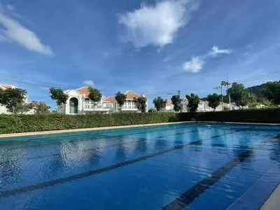 a swimming pool in front of a house at Supicha86 Sino ko kaeo Modern Private 3BR 3BA Villa in Ban Bang Khu
