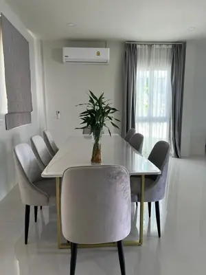 a dining room with a table and chairs at Supicha86 Sino ko kaeo Modern Private 3BR 3BA Villa in Ban Bang Khu