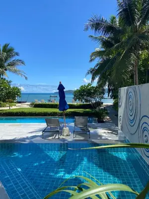 a dress on a statue next to a swimming pool at Beachfront in Surin Beach