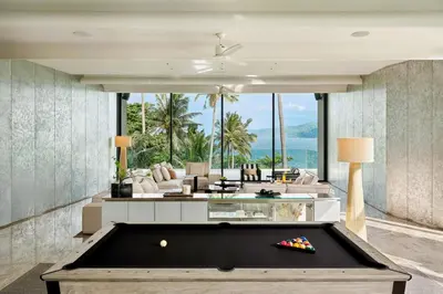 a pool table in a living room with a view at Villa Zai in Kata Beach