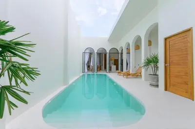 a swimming pool in the middle of a house at Balina Private Pool Villa in Ban Chin Tham Mai
