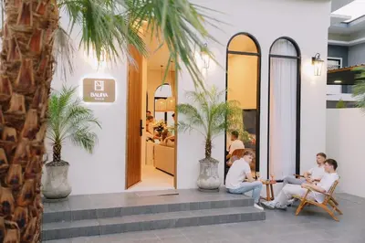a group of people sitting at a table outside a store at Balina Private Pool Villa in Ban Chin Tham Mai