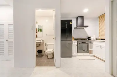 a kitchen with a refrigerator and a toilet in it at 2 bed townhouse, best location, Patong in Patong Beach