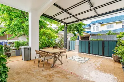 an outdoor patio with a table and chairs at 2 bed townhouse, best location, Patong in Patong Beach