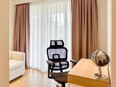a living room with a couch and a chair and a table at Laguna BeachSide Apartment in Bang Tao Beach