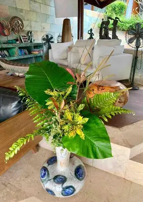 a blue and white vase with a plant in it at Tranquil lake view villa on Phuket golf estate in Kathu