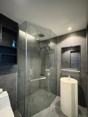 a bathroom with a shower and a toilet and a sink at Citygate Kamala beach, luxury apartment, Phuket in Kamala Beach