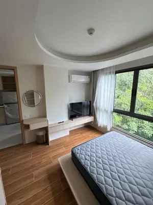 a bedroom with a bed and a large window at 1 bedroom in Kamala Beach in Kamala Beach