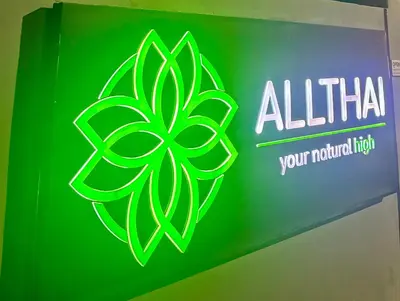 a green sign with a leaf clover on it at 1 bedroom in Kamala Beach in Kamala Beach