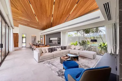 a living room with a white couch and blue chairs at New & Exclusive! Private 4BR Zenithy Luxe Pool Villa near Laguna in Bang Tao Beach