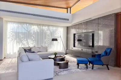 a living room with a white couch and blue chairs at New & Exclusive! Private 4BR Zenithy Luxe Pool Villa near Laguna in Bang Tao Beach