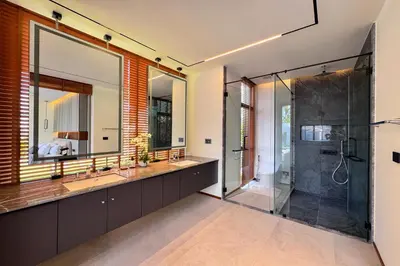 a bathroom with two sinks and a shower at New & Exclusive! Private 4BR Zenithy Luxe Pool Villa near Laguna in Bang Tao Beach