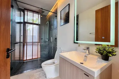 a bathroom with a toilet and a sink and a shower at New & Exclusive! Private 4BR Zenithy Luxe Pool Villa near Laguna in Bang Tao Beach