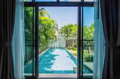 a view of a swimming pool from a window at VILLA Emere Private Pool Nai Harn beach in Nai Harn Beach
