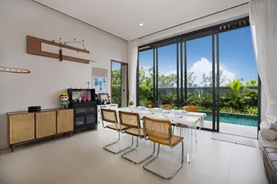 a dining room with a white table and chairs at Chalong Bay View 3BR Pool Villa Long One A4 in Chalong