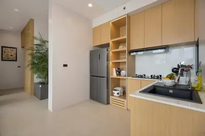 a kitchen with a sink and a refrigerator at Chalong Bay View 3BR Pool Villa Long One A4 in Chalong