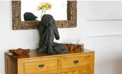 a statue on top of a dresser in a room at Atika Villas xero oceanfront pool villa in Patong Beach