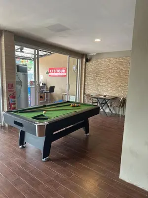 a pool table in a gaming room with a pool table at KT8 Hotel AoNang in Ban Khlong Haeng