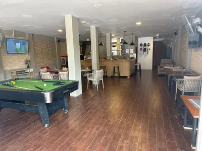 a room with a pool table and a bar at KT8 Hotel AoNang in Ban Khlong Haeng