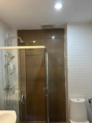 a bathroom with a shower with a toilet and a sink at KT8 Hotel AoNang in Ban Khlong Haeng
