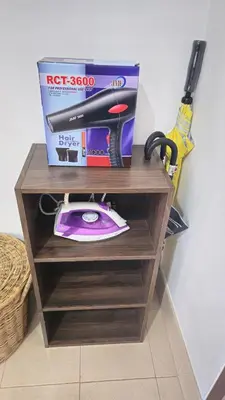 a box on a shelf with a cordless hammer and a scissors at Rawai Naiharn 3 bedroom house in Rawai Beach