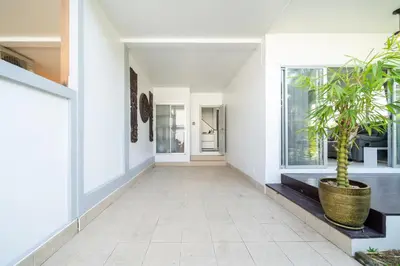 a hallway of a house with a potted plant at Duplex Style 3-BR Corner Private Pool Villa in Ban Pak Lak