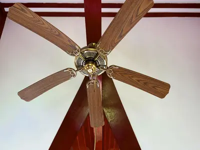 a ceiling fan is hanging from a ceiling at Coco palace resort in Rawai Beach