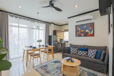 a living room with a couch and a table at Wink City 2 Patong Center close to the Beach in Patong Beach