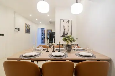 a dining room with a table and chairs at Wink Centre House 10 Patong Beach in Patong Beach