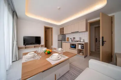 a kitchen with a table with plates on it at now condo near beach 2bedroom in Kamala Beach