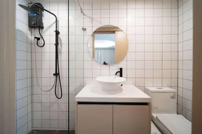 a bathroom with a shower and a sink and a mirror at now condo near beach 2bedroom in Kamala Beach